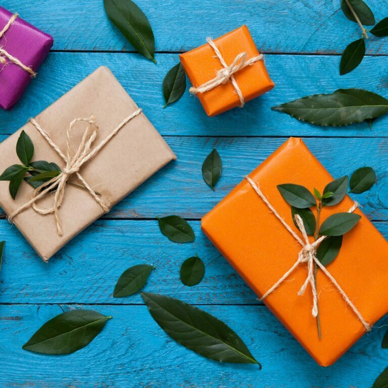 Artisan gifts wrapped in orange paper.